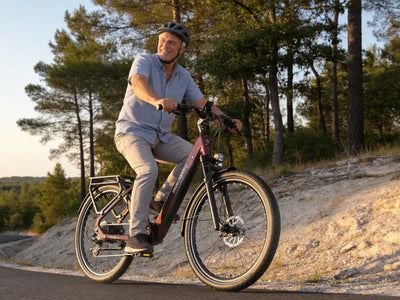 Man riding a red Dukawey FUGL Pro on a gravel path